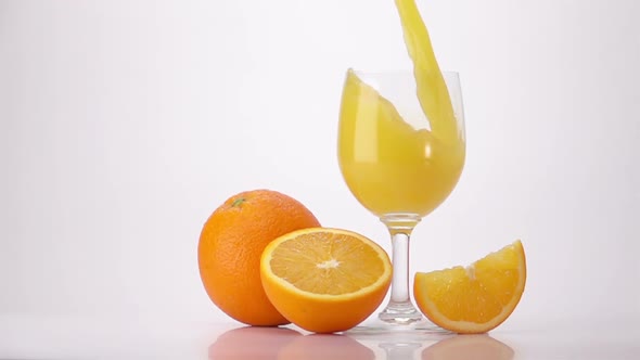 Pouring Orange Juice Into Glass alt
