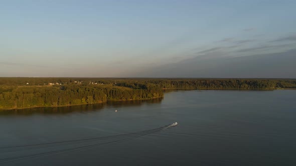 A Shot From a Drone on the Istra Reservoir in the Rays of the Setting Sun the Drone Flies Over the