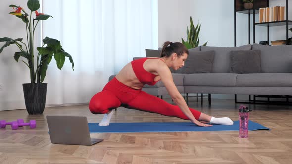 Fit Woman Doing Warmup Stretching Exercise Training on Yoga or Fitness Mat alt