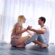 Happy Young Couple in Love Sit on Floor and Hold Hands in Sunny Studio in the Morning - VideoHive Item for Sale