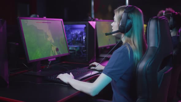 Girl Playing Shooter Video Game alt