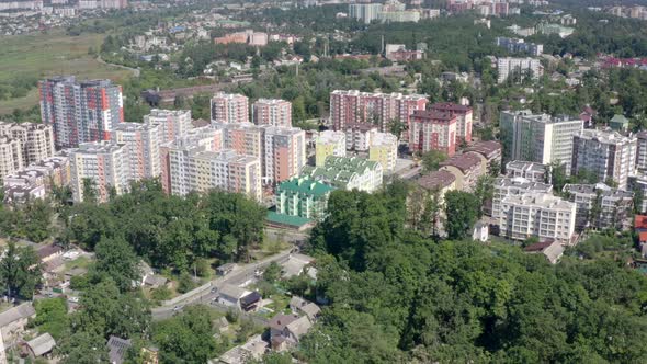 City Buildings Between Green Trees