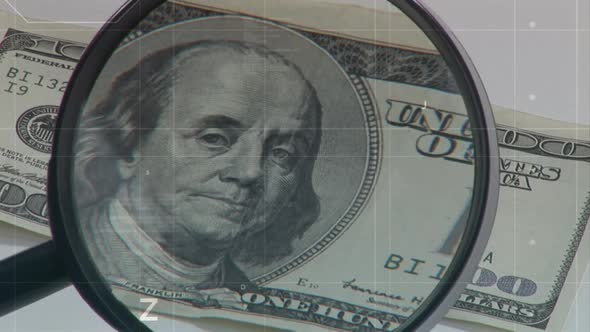 Magnifying lens on a hundred dollar bill alt