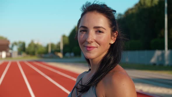 Personal Trainer Looking at Camera Standing in Outdoor alt
