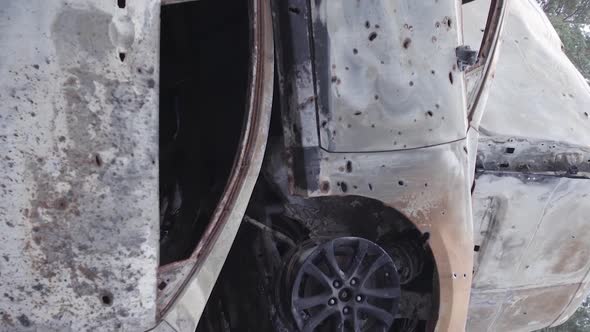Vertical Video Irpin Ukraine  Burnt and Destroyed Cars alt