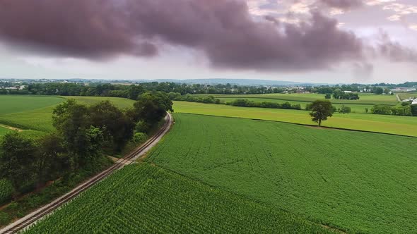 Aerial Traveling View of Corn Fields and Fertile Farmlands and Farms alt