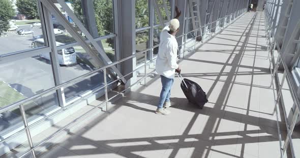 Top View of Young Stylish Afro American Student Young Blond Guy Wears Fashionable White Clothes alt