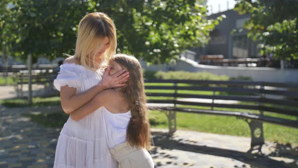 Loving Mom and Daughter Hugging Kissing Outdoors, Stock Footage | VideoHive