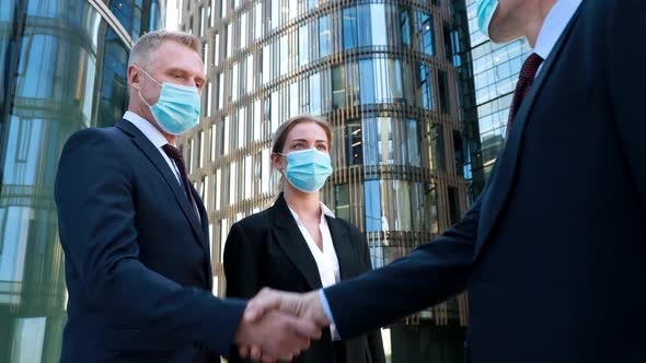 Work During Self-isolation and Quarantine. Young Woman Employee and Her Boss in a Medical Facial