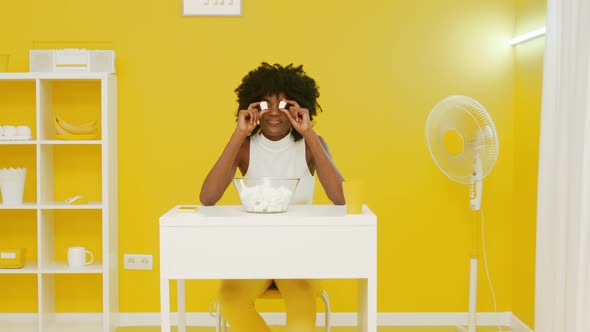 Joyful Woman Is Playing With Marshmallow Pieces alt