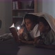 Siblings Reading Book with Flashlight - VideoHive Item for Sale