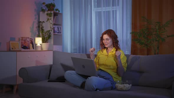 Beautiful Woman Reacts Emotionally While Watching Sports Matches or Playing in Online Casino on alt