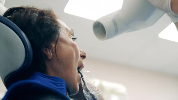Dentist is Preparing Equipment for a Dental Procedure alt