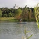 Man Ride on SUP Board in the Mountain Lake in City - VideoHive Item for Sale
