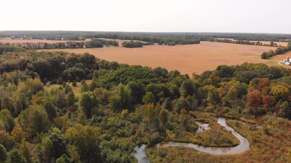  Beautiful Countryside With A Small River And Autumn Trees. Aerial Landscape