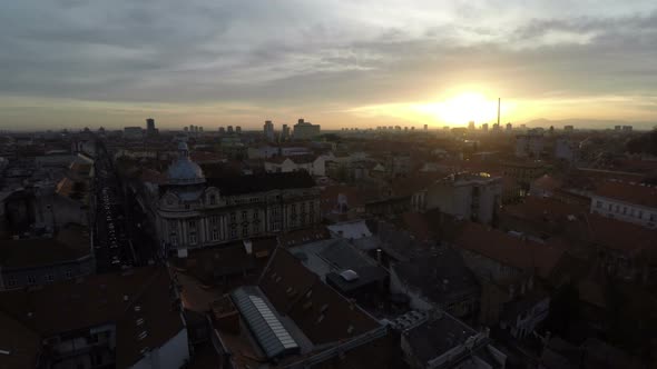 Aerial view of a city at sunset alt