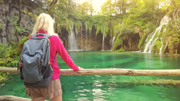 Woman Walking in Plitvice Lakes National Park alt
