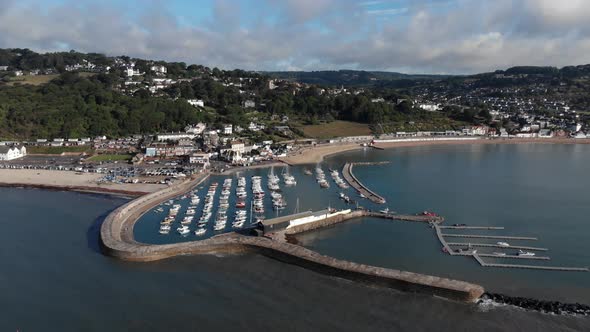 Lyme Regis Harbour, Drone Aerial View From Sea, Dorset, South English Jurassic Coast, Sunny Morning