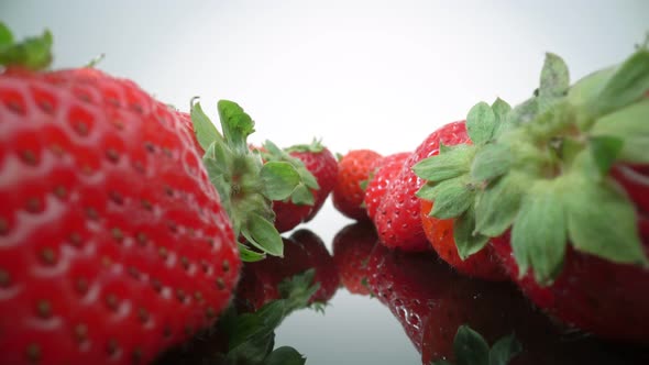Ripe Fresh Natural Strawberries in Reflection in Extreme Macro Close Up alt