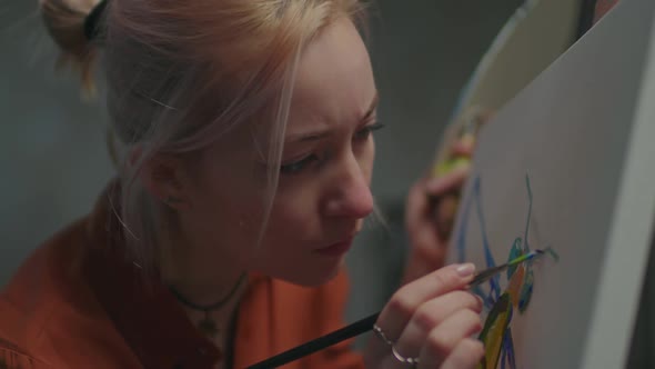 Female Painter in Creative Process in Art Studio alt