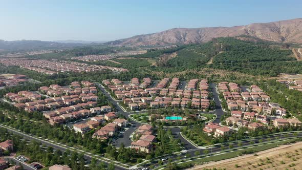 Aerial view showing luxury Orchard Vista Park with many villas during sunny day in Irvine,California alt
