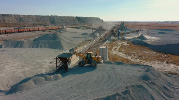 Wheel Loader Load Stone in Crusher Works on Production of Building Materials alt