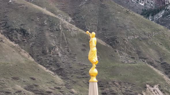 Aerial Crane and Reveal Shot with Telephoto from Angel Moroni on Top LDS Payson Utah Temple and Surr alt