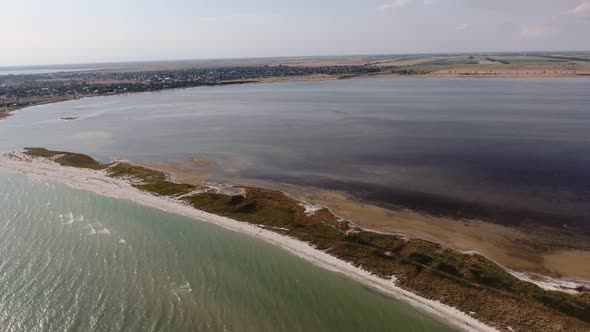 Aerial Shot of a Curvy Sand Spit at the Black Sea Shelf on a Sunny Day in Summer