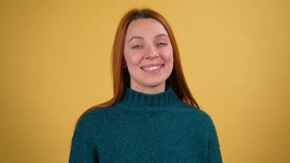 Young Red Hair Woman Posing Isolated on Yellow Color Background Studio alt
