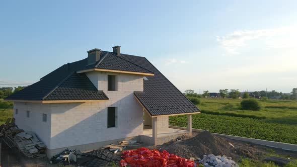 Unfinished Frame of Private House with Aerated Lightweight Concrete Walls and Metal Rooftop Under alt