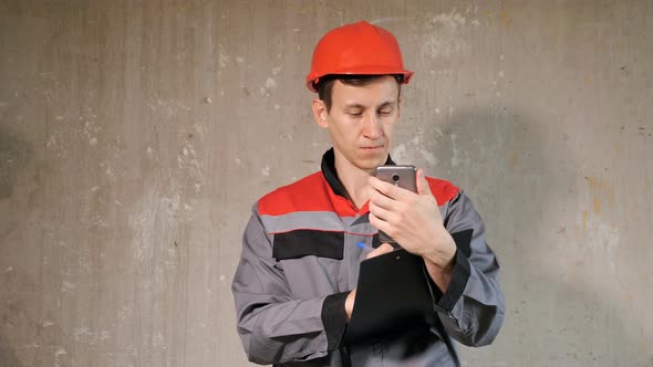 Foreman with Clipboard Using Phone alt
