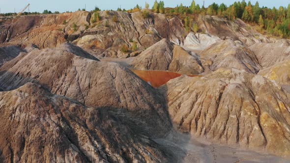 Aerial View of a Landscape Similar To the Planet Mars with Red Hills and Rivers with Red Water alt