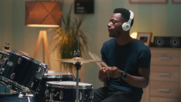African American Drummer Rehearsing in Evening alt