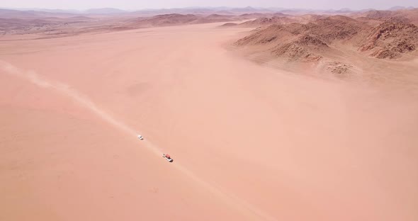 Cars Kicking Dust as They Travel