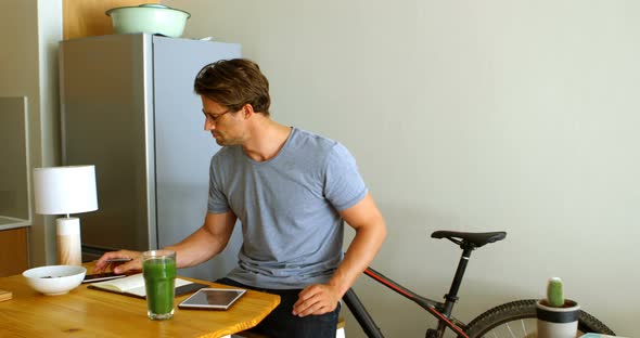 Man Having Blueberries in Kitchen 4k alt
