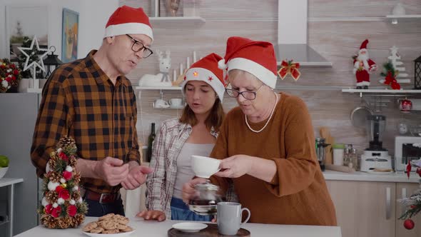 Happy Family Celebrating Christmas Holiday Together Eating Delicious Chocolate Baked Cookies alt