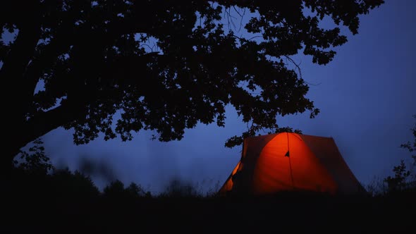 A Tourist Leaves the Tent at Night
