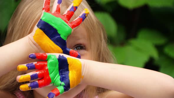 Child hands in paints