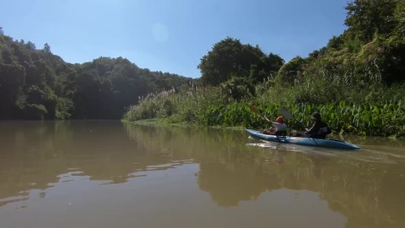 Tandem Kayak Paddling By alt
