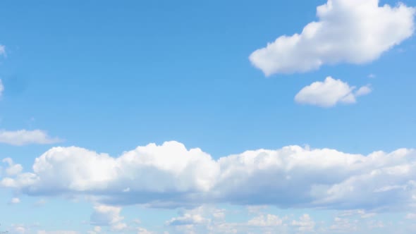 Blue Sky with Clouds and Sun alt