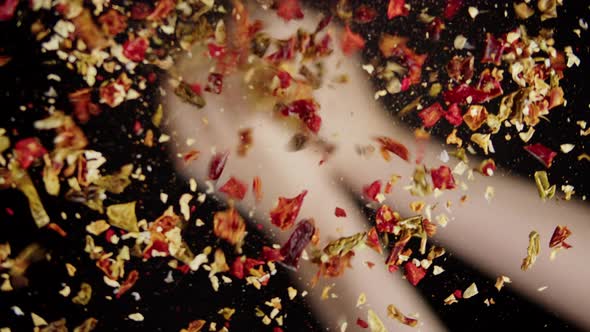 Pouring Spices on Glass on Black Background Using Seasoning and Flavors alt
