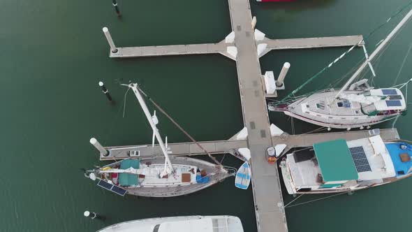 Topdown view along marina pier, boats moored in Ko Olina, Hawaii alt