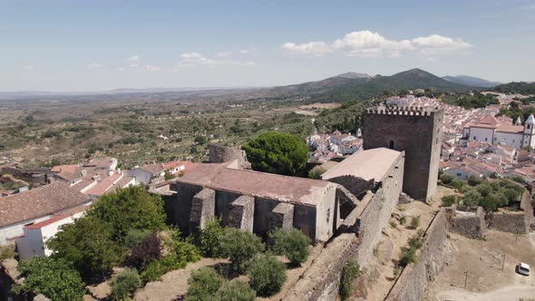 Picturesque hilltop Medieval Castle, Castelo de Vide, Portugal. Aerial dolly out alt