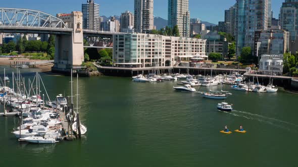Tourists Riding Waterbike At False Creek With Sailing Boats Near Burrard Bridge IN BC, Canada. - aer alt
