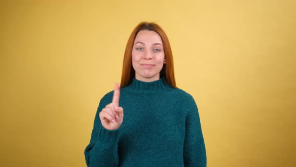 Young Red Hair Woman Posing Isolated on Yellow Color Background Studio alt