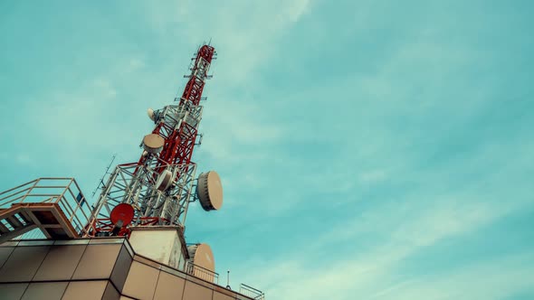 Time Lapse of Telecommunication Tower Against Sky and Clouds in Background alt