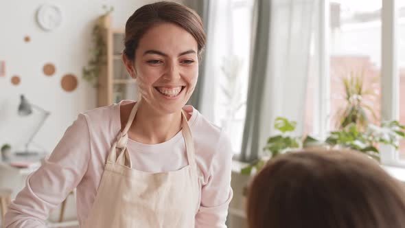 Woman and Her Daughter Cooking and Having Fun alt