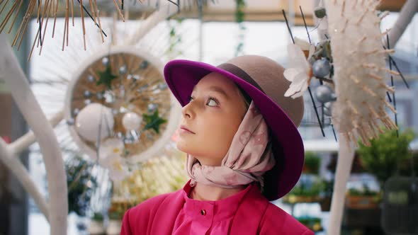 Portrait of Beautiful Young Girl in Pink Coat Standing and Looking Around