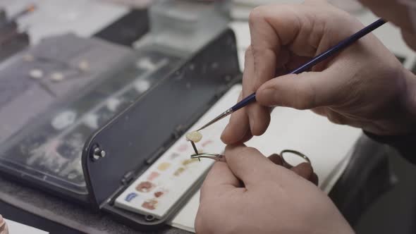 A Dentist Creates a Model of a Jaw Prosthesis and Ceramic Teeth in the Laboratory alt