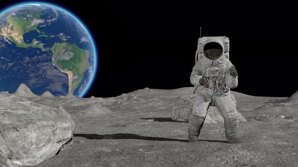 Astronaut Dancing on the moon. Astronaut in outer space celebrating good luck. Seamless loop.